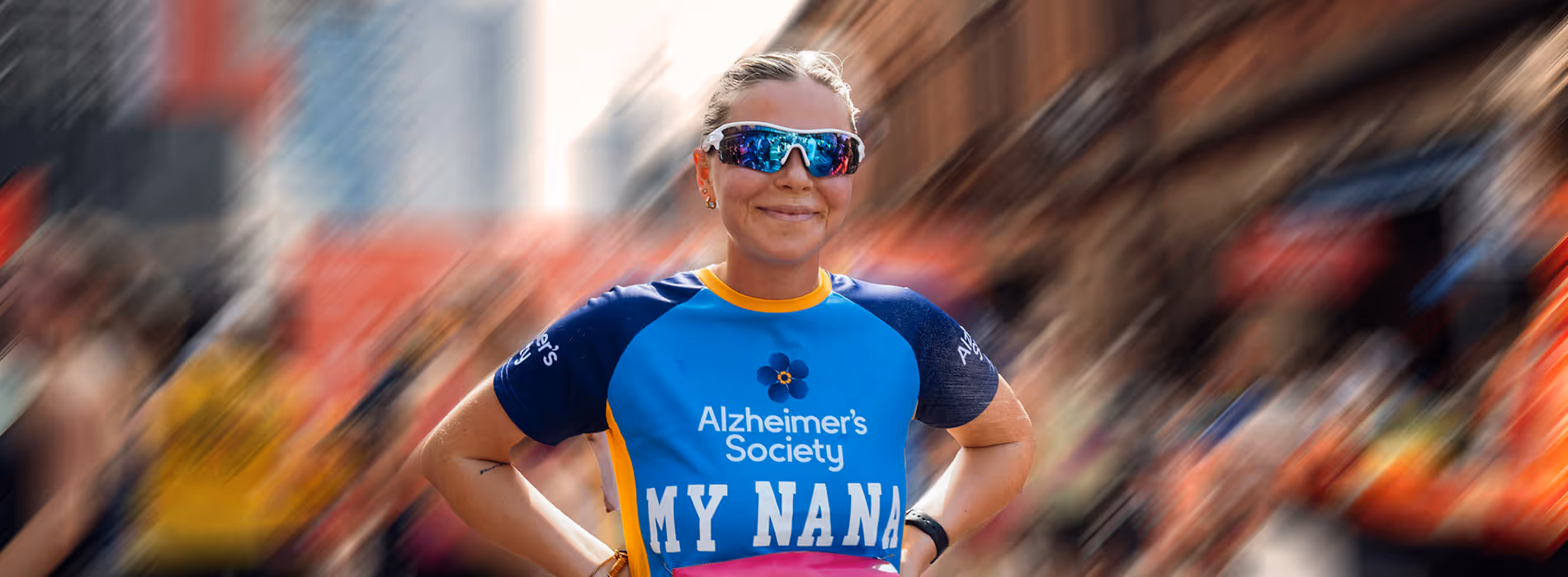 Image shows a smiling runner wearing a charity t-shirt reading For Nan