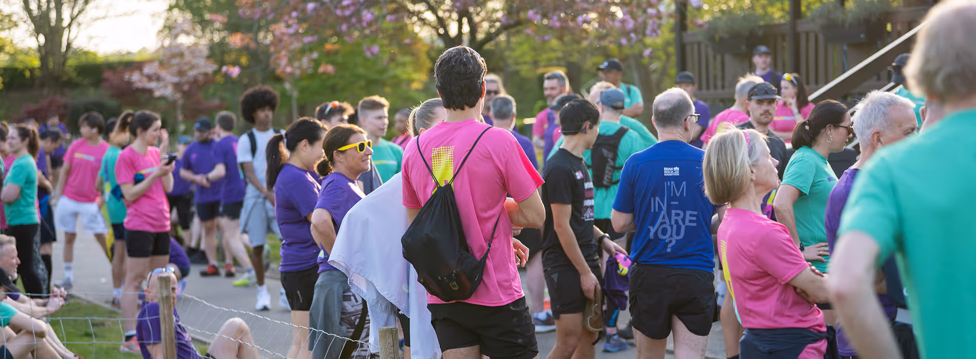 Image shows a number of runners waiting to start a community run