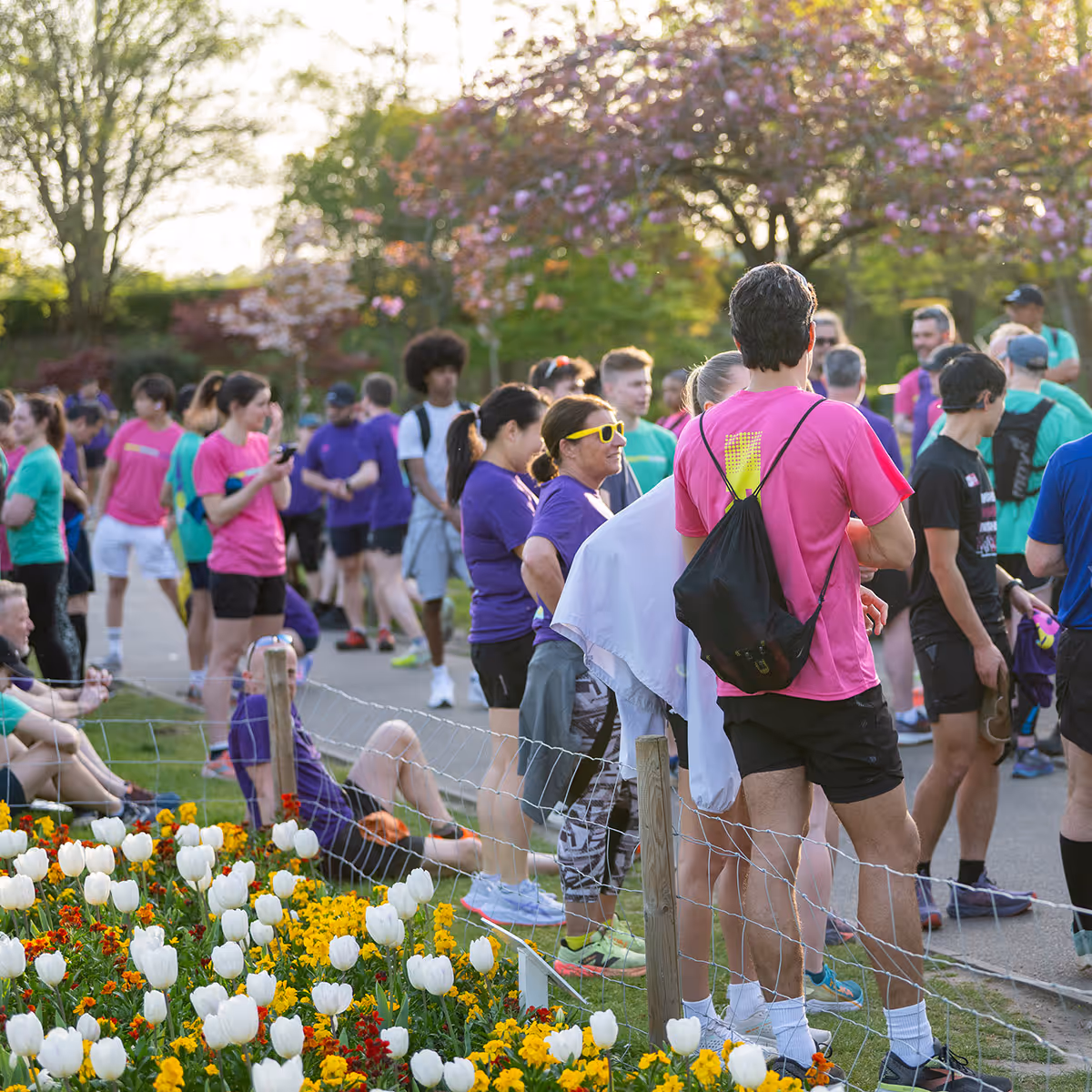 Image shows a number of runners waiting to start a community run